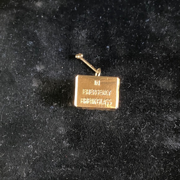 Gold Emergency Breakaway Charm with real dollar inside box